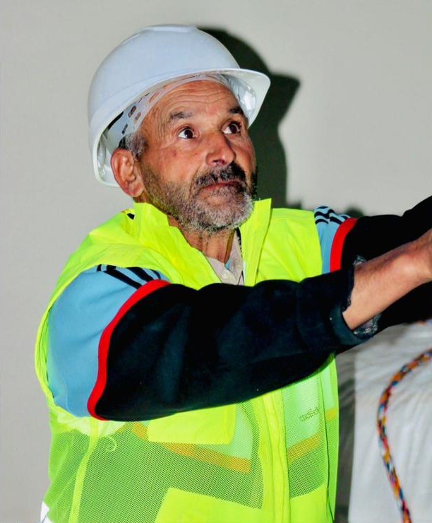 Experienced maritime operations professional in safety gear at a Moroccan port
